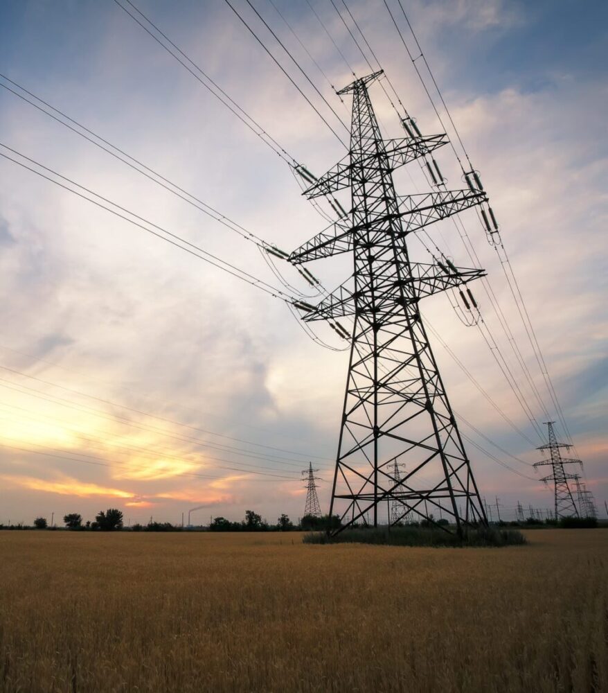 interconnection power lines on a cloudy day at sunrise